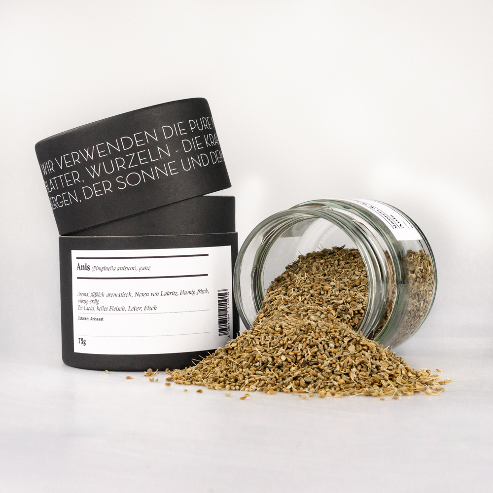 Anis, ganz Anis ganz – offenes Gewürzglas mit Gewürzdose daneben