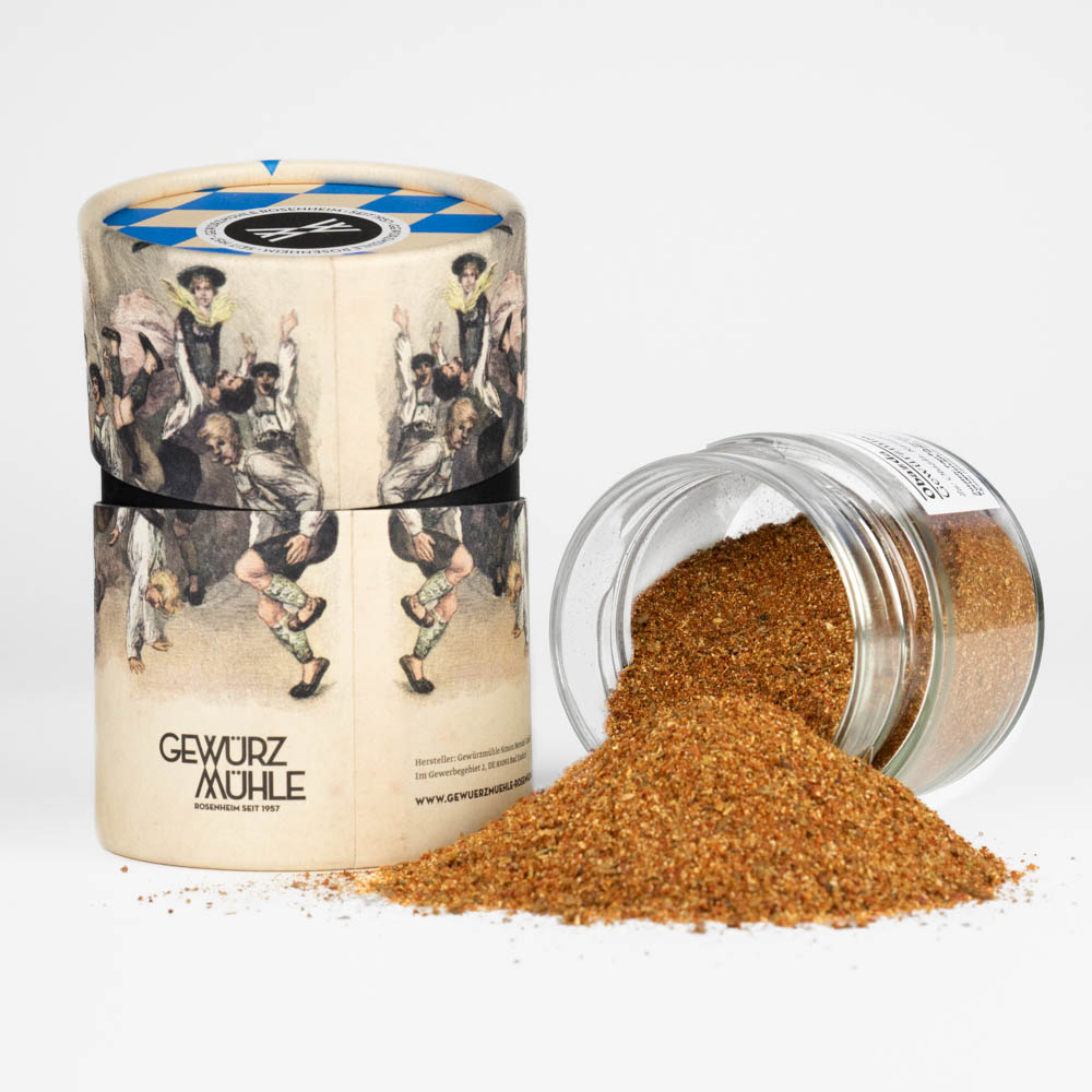 Obazda Gewürzmischung - offenes Gewürzglas mit Gewürzdose im bayerischen Design daneben